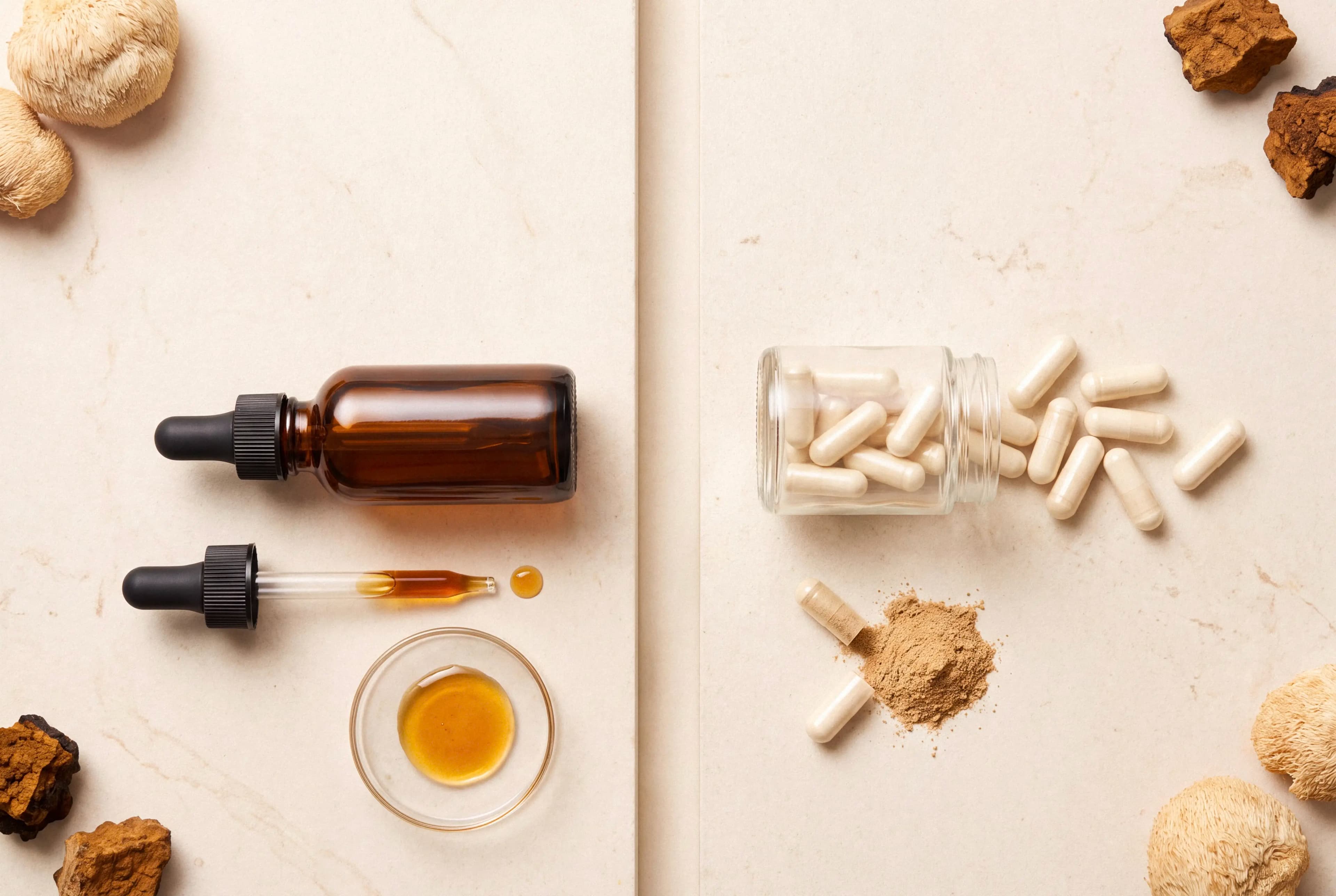 Unlabeled mushroom tincture bottle and dropper beside spilled mushroom capsule extracts on a cream surface