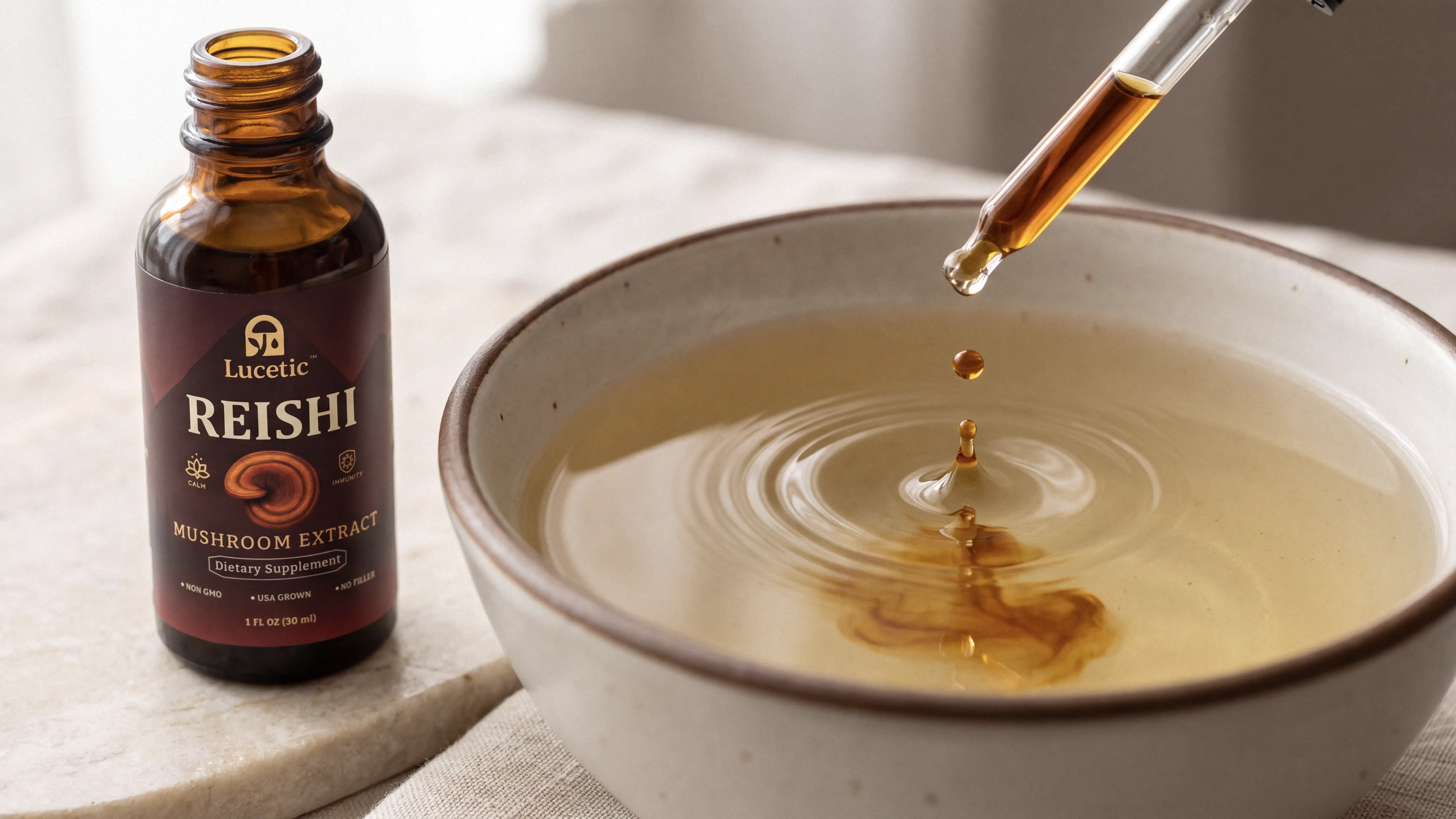 A dropper of Reishi tincture above a bowl
